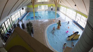 An indoor swimming pool with multiple lanes and a central play area. - Cozy Tiny House, gas Fireplace, Near Maastricht (Susteren)