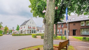 A building with a sign that reads "JISSAALON CLEVERS". - Scenic Escape With Garden (Grubbenvorst)