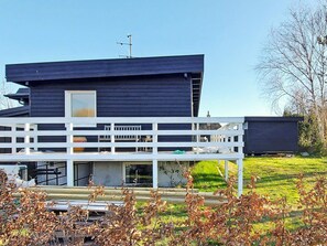 A modern two-story house with a balcony and a flat roof. - 6 Person Holiday Home in Rude (Bisserup)