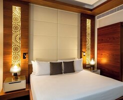Premium bedding, down comforters, memory foam beds, minibar