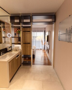 A modern bathroom with a vanity, mirror, and sink. - 24Seven Hotel Schwabach (Schwabach)