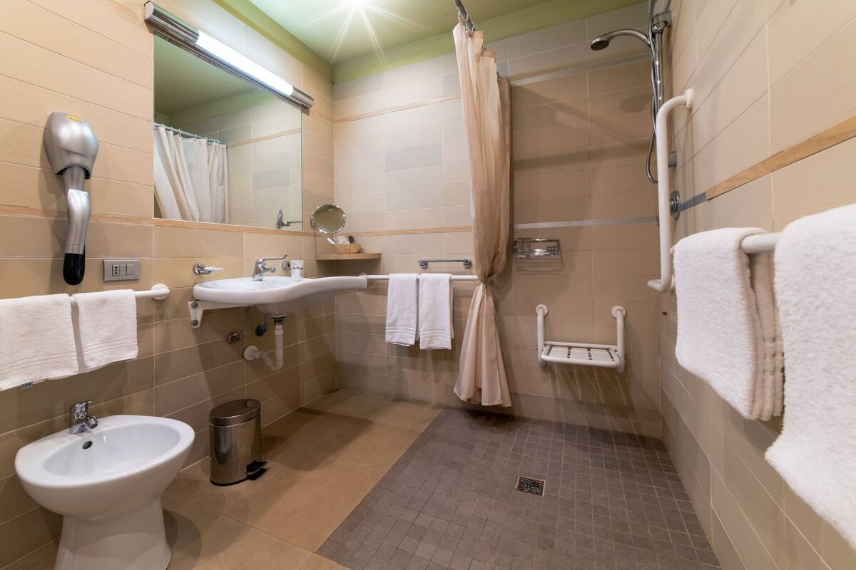 superior double or twin room | bathroom | shower, free toiletries, hair dryer, dressing gowns