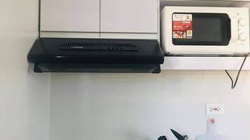 Fridge, microwave, electric kettle, cookware/dishes/utensils