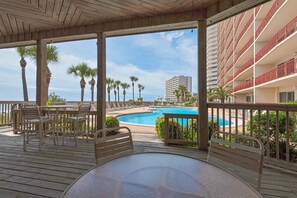 Relax by the pool surrounded by palm trees and take in the city views from this outdoor deck.