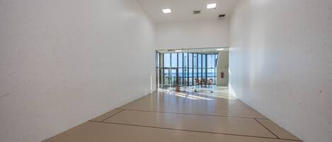Challenge someone to a game of racquetball on the indoor glass-enclosed court at Phoenix III with a view of the beach