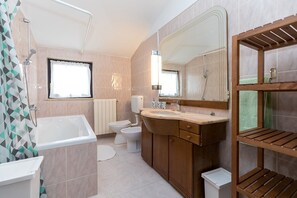 A modern bathroom with a bathtub, a sink, a toilet, and a shower. - Ultimate Relaxation at Our Beautiful Villa: Private Pool, Jacuzzi, and BBQ Near Poreč (Stanici Kod Nove Vasi)
