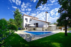 A two-story house with a swimming pool, a balcony, and a garden. - Ultimate Relaxation at Our Beautiful Villa: Private Pool, Jacuzzi, and BBQ Near Poreč (Stanici Kod Nove Vasi)