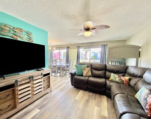 Condo, 3 Bedrooms, Balcony, Partial Ocean View (No Pets - C105) | Living area | 50-inch flat-screen TV with cable channels, TV - Sea Oats by ALBVR (Gulf Shores)