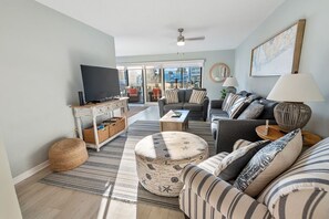 Condo, 3 Bedrooms, Balcony, Pool View (Pet Friendly – B105) | Living area | 50-inch flat-screen TV with cable channels, TV - Sea Oats by ALBVR (Gulf Shores)