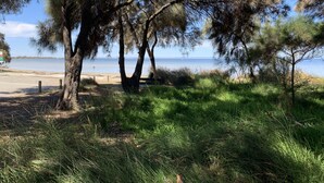 A beach with trees and a clear view of the sea. - Skylight Retreat Falcon (Falcon)