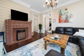 Smart TV, fireplace, books, music library