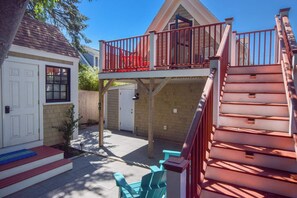 A two-story building with a balcony, a door, and a staircase. - 1 Min. Walk to Water/Town Deck and A/C! (Provincetown)