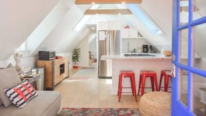 A loft-style apartment with a kitchen, dining area, and living space. - 1 Min. Walk to Water/Town Deck and A/C! (Provincetown)