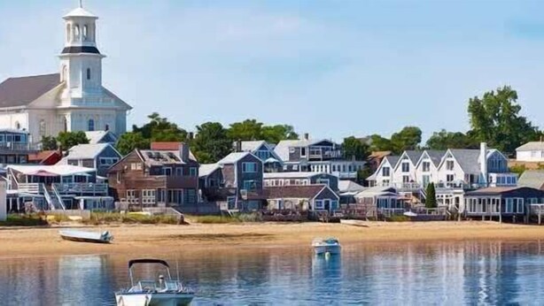 A coastal town with a prominent white church, waterfront properties, and a sandy beach. - 1 Min. Walk to Water/Town Deck and A/C! (Provincetown)