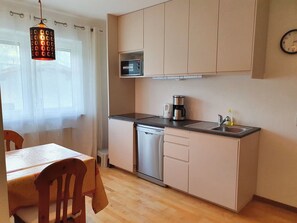 Fridge, microwave, stovetop, coffee/tea maker