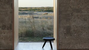 A room with a large window, a wooden floor, and a concrete wall. - Pump Station by Bloom Stays in Dungeness - stunning location (Dungeness)