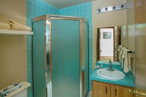 Shower, hair dryer, towels, shampoo