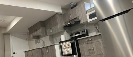 Microwave, coffee/tea maker, cookware/dishes/utensils