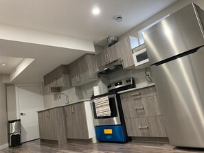 Microwave, coffee/tea maker, cookware/dishes/utensils