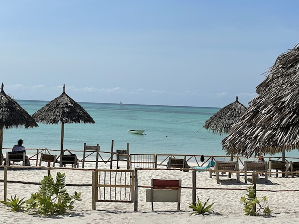 Private beach, white sand, sun-loungers, beach umbrellas