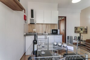 Fridge, microwave, stovetop, coffee/tea maker