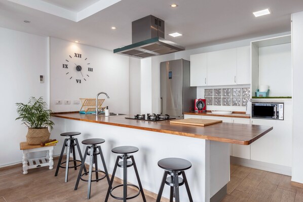 Fridge, microwave, stovetop, coffee/tea maker