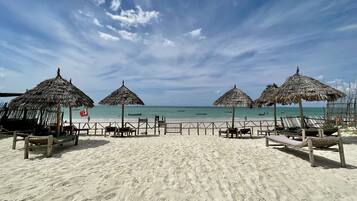 Private beach, white sand, sun-loungers, beach umbrellas