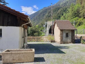 Experience the charm of a traditional farmhouse in a picturesque mountain setting.