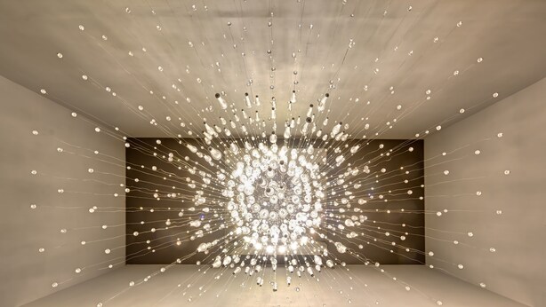 A modern interior with a unique ceiling light installation. - Abar Hotel Apartments (Dubai)