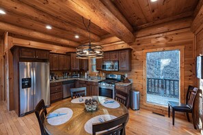 Microwave, dishwasher, coffee/tea maker, mixer - Secluded log cabin with fireplace and hot tub on deck. (Bryson City)