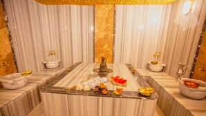 A luxurious bathroom with marble walls, a central sink, and various toiletries. - Old Town Point Hotel & Spa Antalya (Antalya)