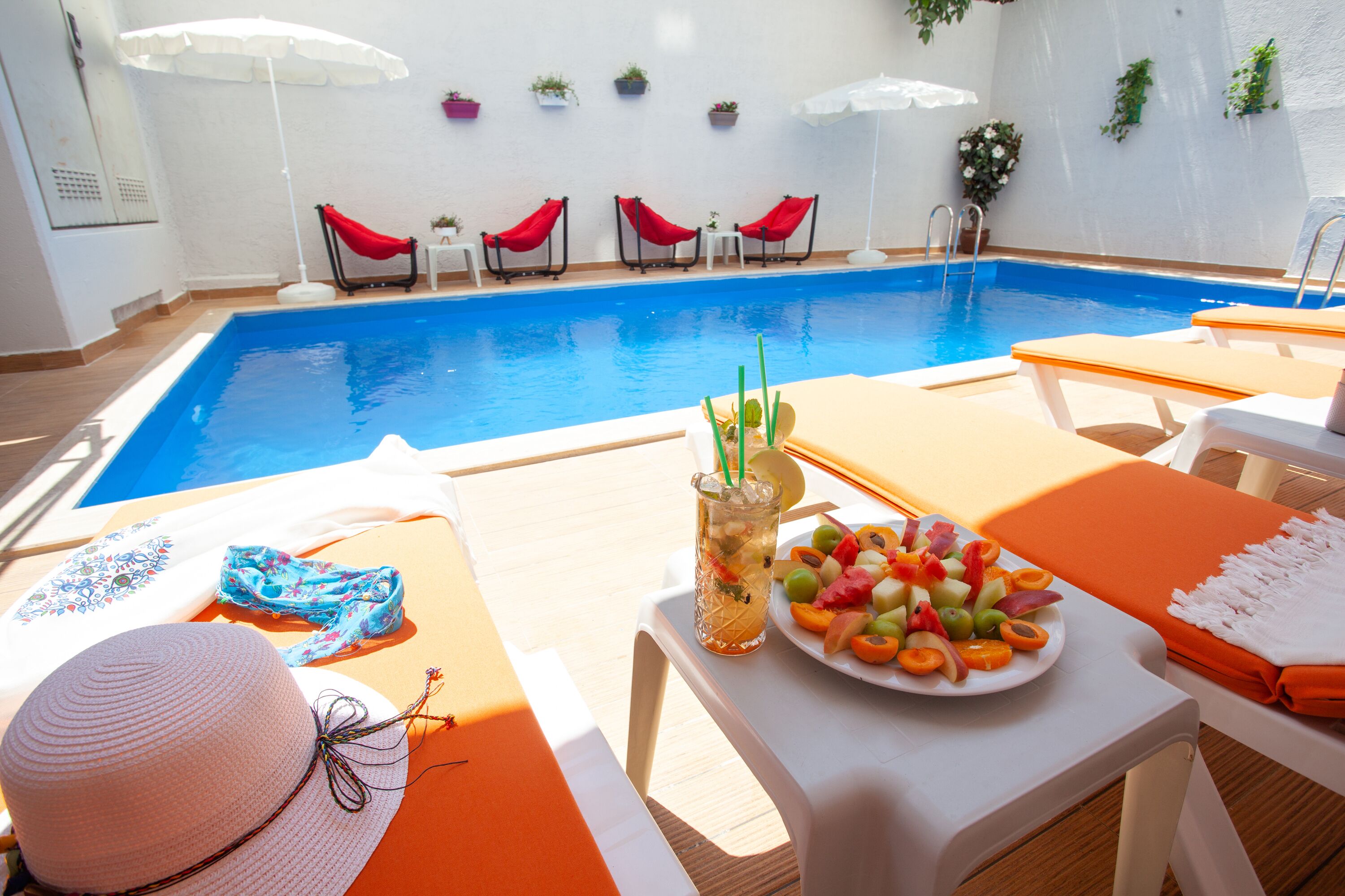 Seasonal outdoor pool, open 10:00 AM to 7:00 PM, sun loungers