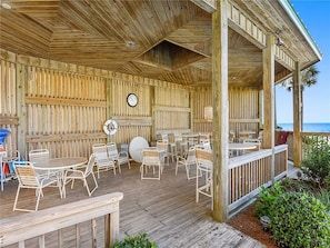 Relax on the deck with comfortable seating and enjoy the surrounding greenery.