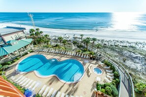 Relax by the pool with a clear view of the ocean and access to the beach.