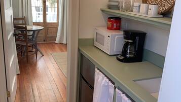Fridge, microwave, coffee/tea maker, cookware/dishes/utensils