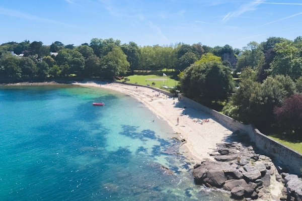 On the beach, sun-loungers