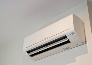 A Mitsubishi Electric air conditioner mounted on a wall.