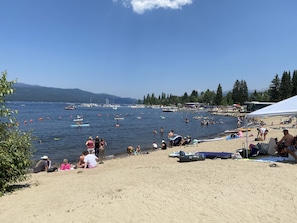 Guests can enjoy swimming, sunbathing, and water activities from the beach.