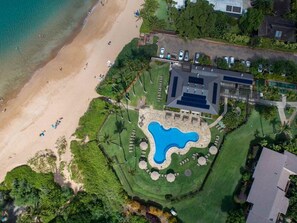 Enjoy a beach and central pool in a beautifully landscaped setting.