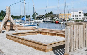 Guests can enjoy waterfront views from the marina's wooden deck area.