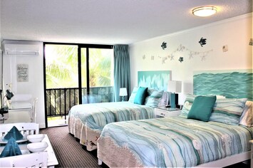 2 Full beds.  New sliders open to small lanai. New split system air conditioner.