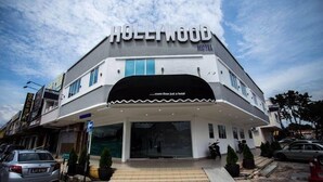 A hotel named 'Hollywood' with a modern design, featuring a prominent entrance and a sign stating 'more than just a hotel'. - Hollywood Hotel (Ipoh)