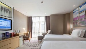 A hotel room with two beds, a desk, a chair, and a large window. - Lavande Hotel (Foshan Shunde Jinlong Metro Station) (Foshan)