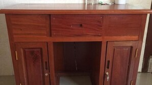 A wooden desk with two drawers and a small shelf on top. - 139 Guest House (Phnom Penh)