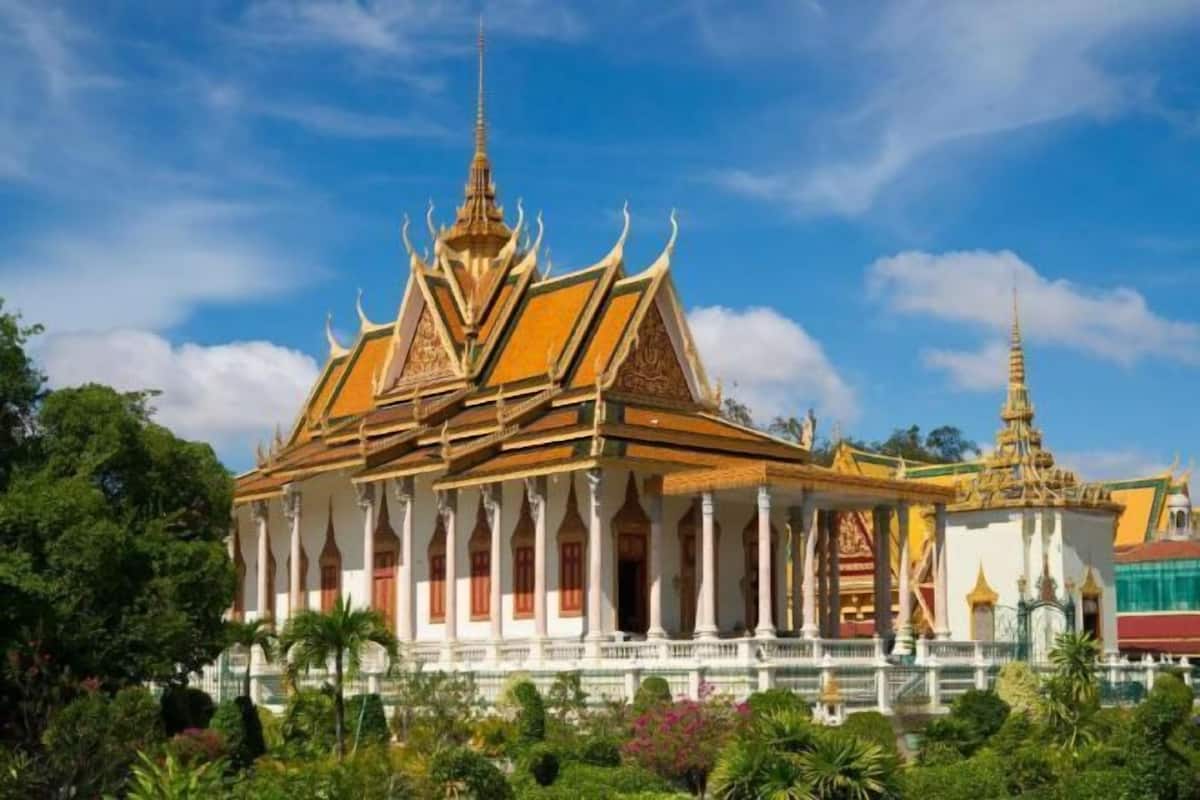 A traditional Thai temple with ornate architecture, including a multi-tiered roof and golden spires.