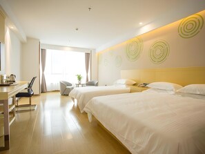 A hotel room with two beds, a desk with a chair, a small table with a plant, and a large window with curtains. - Greentree Inn Wuxi Rongchuang Cultural Tourism City Nanquan Town Business Hotel (Wuxi)