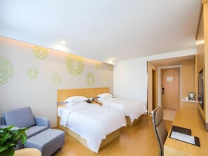 A hotel room with two beds, a sofa, a desk, and a mirror. - Greentree Inn Jiaxing Qixing Town Goverment (Jiaxing)