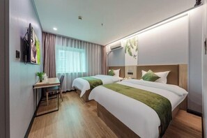 A hotel room with two beds, a desk, a chair, a TV, and a window with curtains. - GreenTree Inn (Shanghai Xuhui Xujiahui Yishan Road Metro Station) (Shanghai)