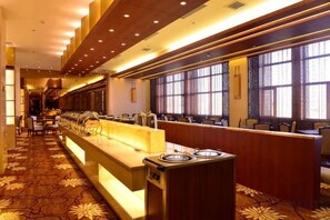 A hotel lobby with a long reception desk, seating area, and large windows. - Min Le Long Xin Hotel (Minle)