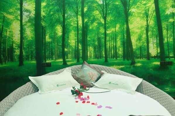 A bed with white linens and two pillows, set against a forest backdrop. - Yunshan Hotel (Jishishan)